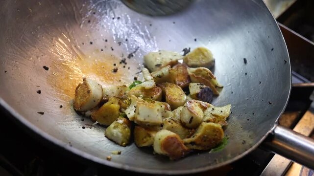 Fried idli with ghee and curry leaves