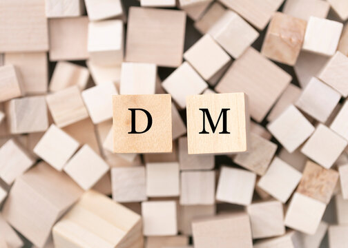  Direct massage concept. Abstract geometric wooden dice.   DM icon.