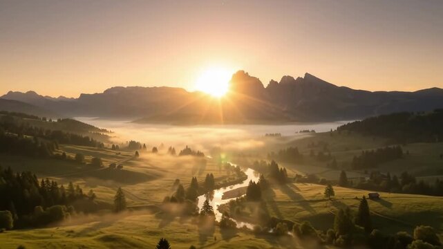 Aerial time lapse tracking pan of sun rising over foggy mountain valley with winding river and backlit meadows at sunrise