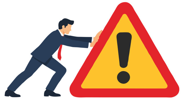 A determined businessman in a dark navy suit leans his weight forward to push back a giant yellow caution hazard sign with a red border, rendered in an expressive modern flat vector style