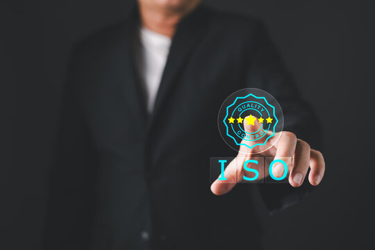 Businessman touching virtual ISO quality control certification badge with stars. Standard guarantee, service assurance, business excellence, and customer satisfaction compliance management.