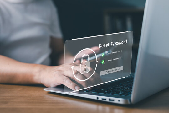 Man resetting password on laptop computer with virtual lock screen interface. Cybersecurity, account recovery, user authentication, data privacy, and access protection concept at home office.