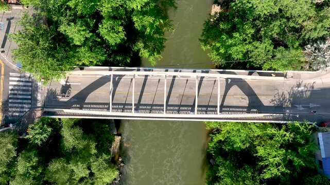 Honda City with Bridges Crossing the Magdalena River in Tolima, Colombia. Establishing Shot. Aerial View.