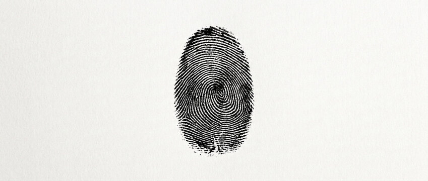 Close up of a black fingerprint on a light textured background symbolizing identity and security