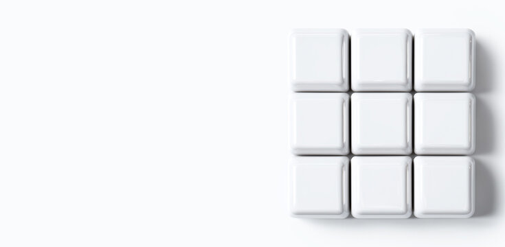 Nine blank white plastic cubes blocks grid pattern arranged together on clean plain white background surface, minimalist square shapes concept template design with empty space
