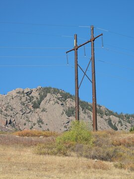 Power Lines Crossing Prairie near Rocky Foothills in Boulder, Colorado