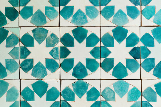 Turquoise and white geometric Islamic mosaic tile texture, traditional ceramic background