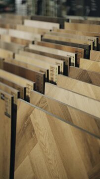 Exploring elegant finishing materials in a shop showcasing laminate and parquet