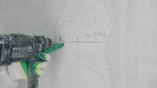 Marking and drilling for electrical sockets in an apartment renovation
