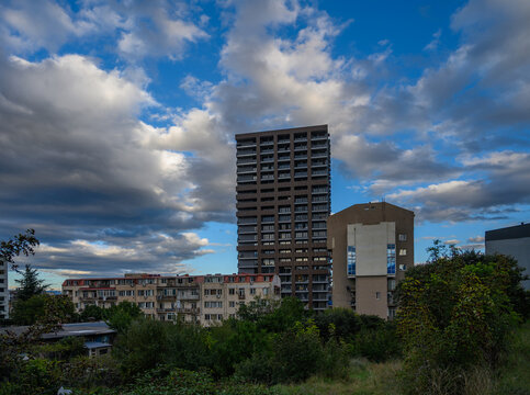 September 23, 2026, Tbilisi, Georgia: Mixed urban architecture and high-rise tower under dramatic clouds