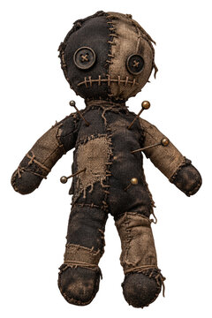 A creepy voodoo doll with buttons for eyes and pins stuck into its body. The doll is made of patchwork fabric in black and beige
