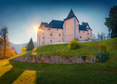 Sunny autumn view of Greinburg Castle on the shore of Danube river. Colorful morning cityscape of Greinburg town, district Perg, Austria, Europe. Traveling concept background.