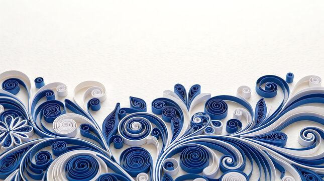 Decorative border of blue and white quilled paper swirls, coils, and floral shapes arranged on a plain white background, with ample copy space