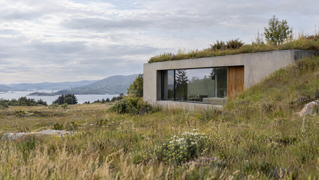 Earth sheltered home with a native planted berm