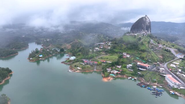 Guatap&eacute; Featuring El Pe&ntilde;&oacute;n de Guatap&eacute; Monolith and Scenic Reservoir Landscape in Antioquia, Colombia. Establishing Shot. Aerial View.
