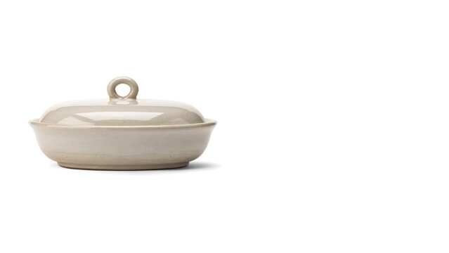 Minimalist cream stoneware dish with lid, elegant ceramic butter dish isolated on white, neutral kitchenware for home cooking and food presentation