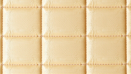 Fototapeta premium Quilted tan leather upholstery texture