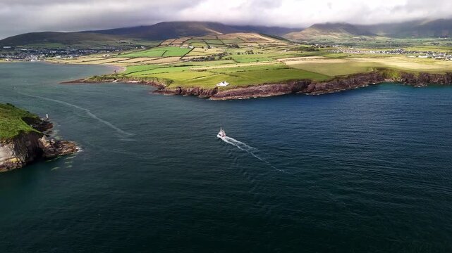 Drone tracking a ship approaching Dingle Harbour, Ireland