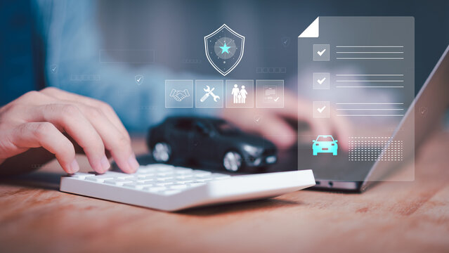 An insurance agent calculates auto insurance costs while reviewing vehicle coverage, policy options, premium estimates, risk assessment, claims protection, benefits, and customer eligibility.