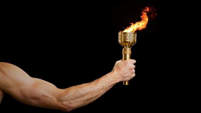 Masculine man's arm holding flaming torch