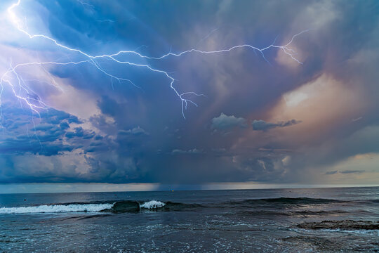 Dramatic Lightning Bolts Striking Across Dark Stormy Night Sky A stormy sky with lightning in the background