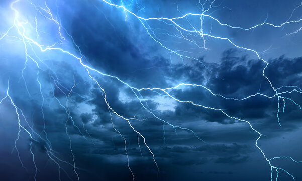 Dramatic Lightning Bolts Striking Across Dark Stormy Night Sky A stormy sky with lightning in the background