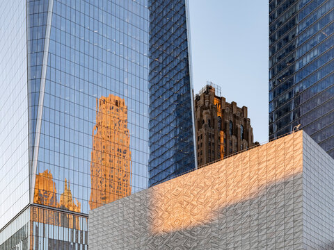 New York City, New York &ndash; October 3, 2026: Glass skyscraper at the World Trade Center, Lower Manhattan, with the reflection of an older brick tower in the glass. 