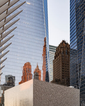 New York City, New York &ndash; October 3, 2026: Older brick tower with a setback crown between two glass skyscrapers at the World Trade Center.