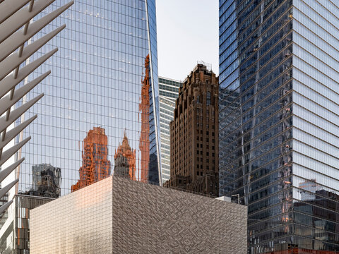 New York City, New York &ndash; October 3, 2026: Older brick tower with a setback crown between two glass skyscrapers at the World Trade Center.