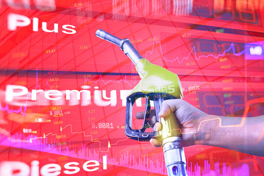 Diesel fuel nozzle overlaid with financial charts, market data and price indicators, representing fuel costs, diesel prices, energy markets, oil industry, inflation and economic trends.