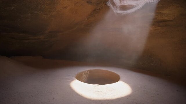 Light ray shines inside a cliff dwelling colorado stone kiva chamber