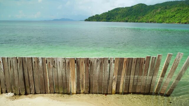 Wooden Fence Along Tropical Beach