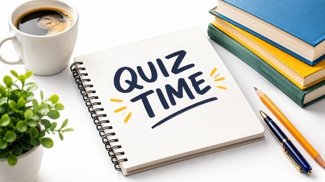 A notebook with the words quiz time written on the cover, placed next to a coffee cup and textbooks