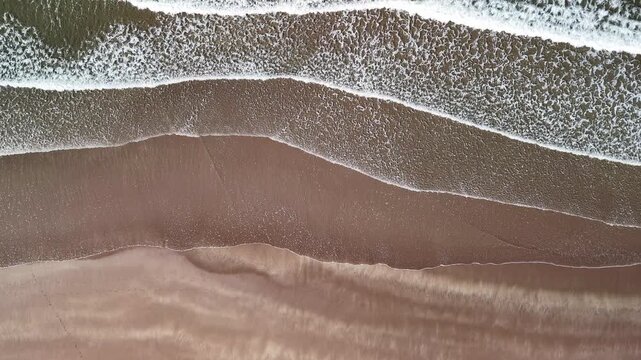 Panoramic view of waves rolling onto Inch Beach, Ireland