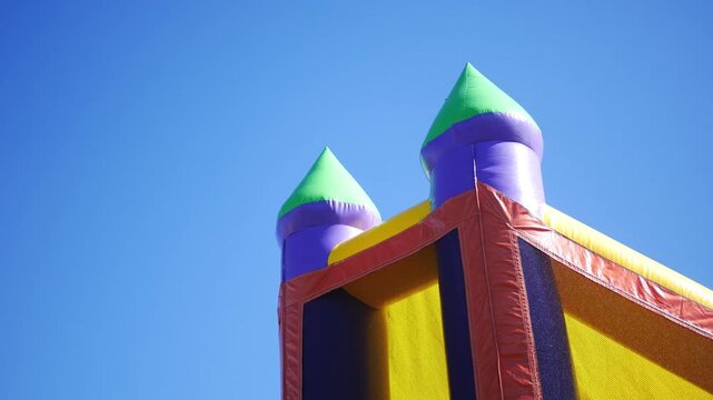 Castle Style Bounce House over clear blue sky