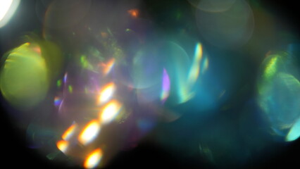 Abstract colorful light bokeh overlay on black background © Ahmad Khan