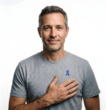 Man touching heart blue awareness pin