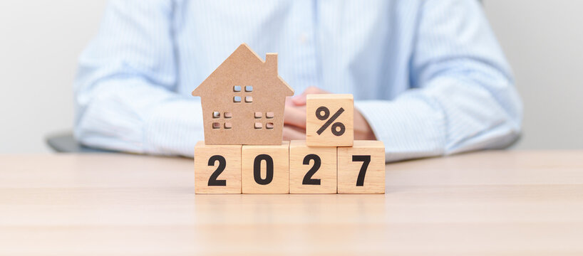 2027 New Year with percentage change to UP and Down arrow with Home model. Real estate Mortgage, Refinance, House loan and debt, Interest rate, Insurance, Financial and Property Tax