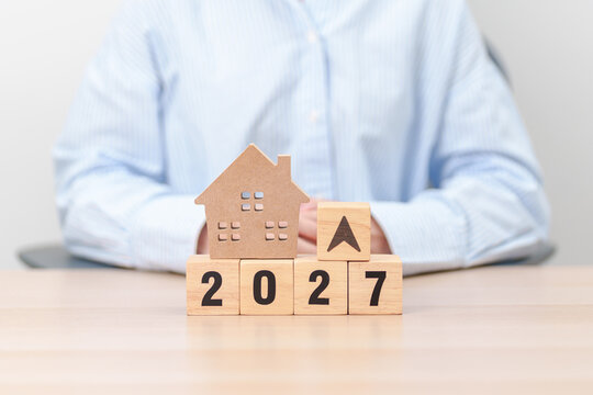 2027 New Year with percentage change to UP and Down arrow with Home model. Real estate Mortgage, Refinance, House loan and debt, Interest rate, Insurance, Financial and Property Tax