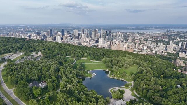 Montreal downtown skyline from Mount Royal with park, lake and greenery in summer, Quebec, Canada. g.