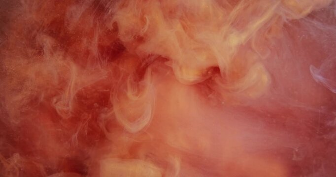 Haze flow. Mist swirl. Colorful paint blending in water texture. Orange red pigment spilling wave liquid abstract defocused background.