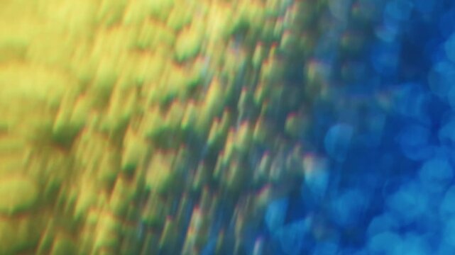 Twinkling particles. Blur confetti light. Yellow blue flare leak defocused beam spin bokeh reflection. Colorful abstract flicker luminosity background.