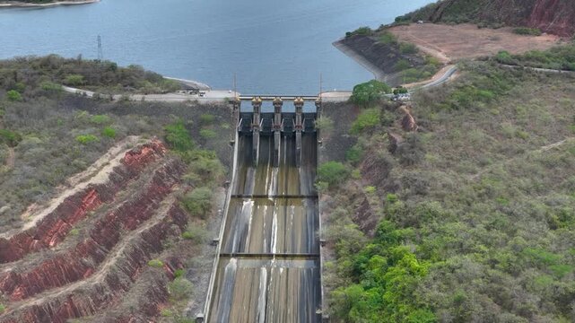 Betania Dam Spillway and Hydroelectric Infrastructure in Huila, Colombia. Establishing Shot. Aerial View.