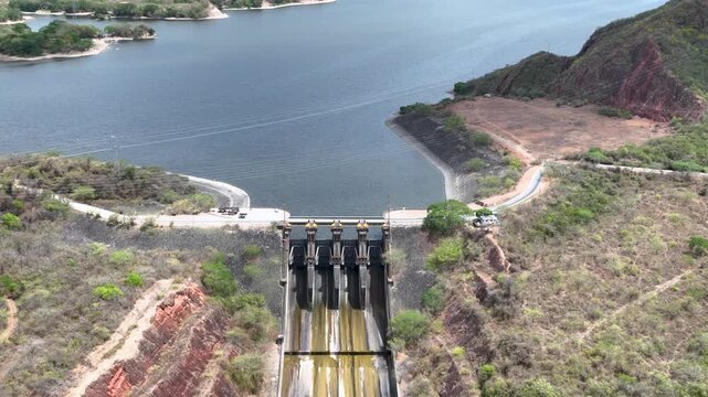 Betania Dam Spillway and Hydroelectric Infrastructure in Huila, Colombia. Establishing Shot. Aerial View.