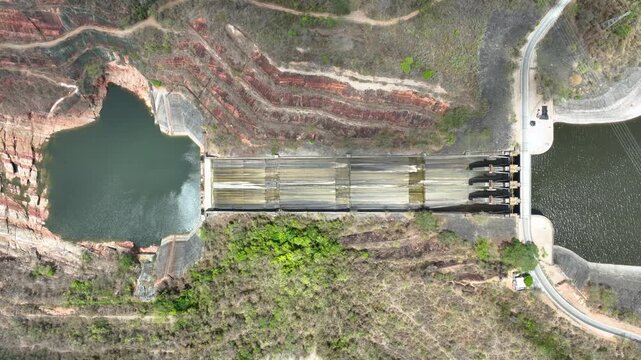 Betania Dam Spillway and Hydroelectric Infrastructure in Huila, Colombia. Establishing Shot. Aerial View.