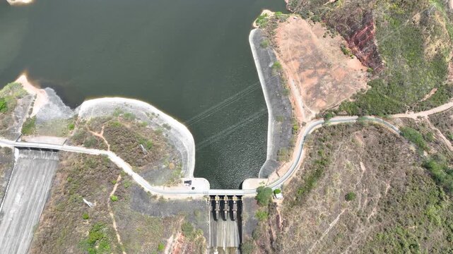 Betania Dam and Hydroelectric Reservoir in Huila, Colombia. Establishing Shot. Aerial View.