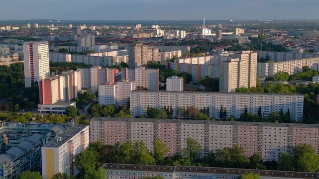 Sprawling urban landscape of residential prefabricated housing buildings, reflecting city planning and density. prefabricated housing. Best aerial view static hovering drone panorama