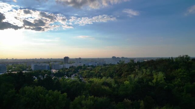 Berlin cityscape with residential apartment blocks and green spaces, reflecting German urban architecture and housing. Fantastic aerial view ascending drone panorama