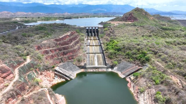 Betania Reservoir and Hydroelectric Dam Surrounded by Mountains in Colombia. Establishing Shot. Aerial View.