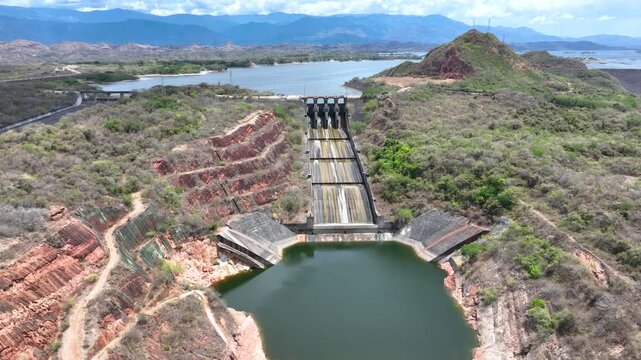 Betania Reservoir and Hydroelectric Dam Surrounded by Mountains in Colombia. Establishing Shot. Aerial View.